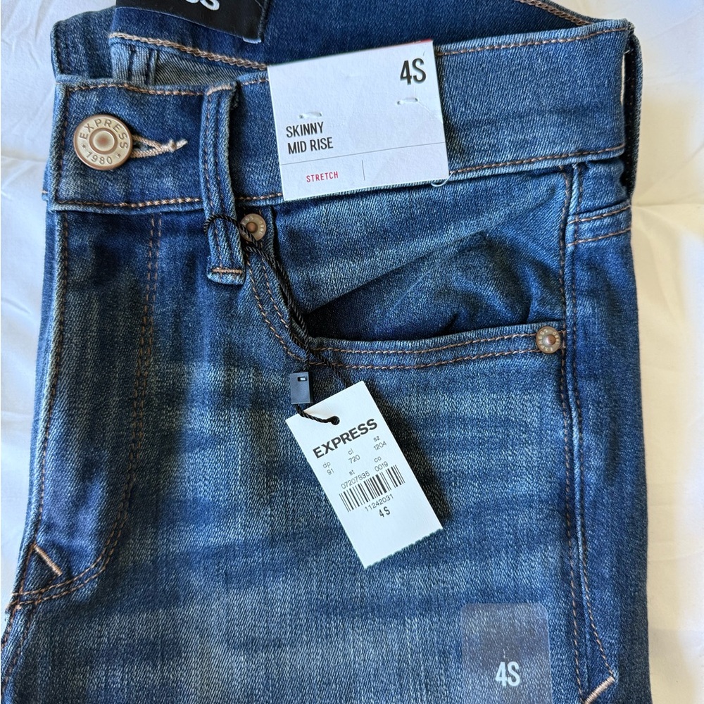 Express Women’s Mid Rise Skinny Stretch Jeans